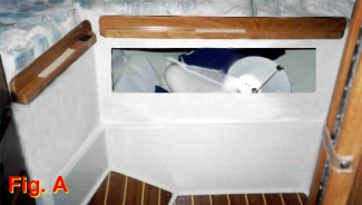 Original hole in forward bulkhead under V-berth after removal of the standard drawer